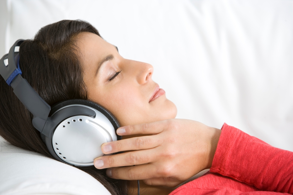 Woman Relaxing Listening To Music Wearing Headphones